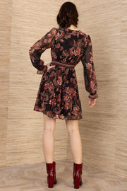 back of a woman wearing an A-Line short long sleeve dress with floral pattern