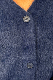 close-up of a blue cardigan