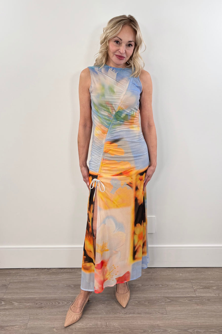 Woman wearing a light colored floral dress