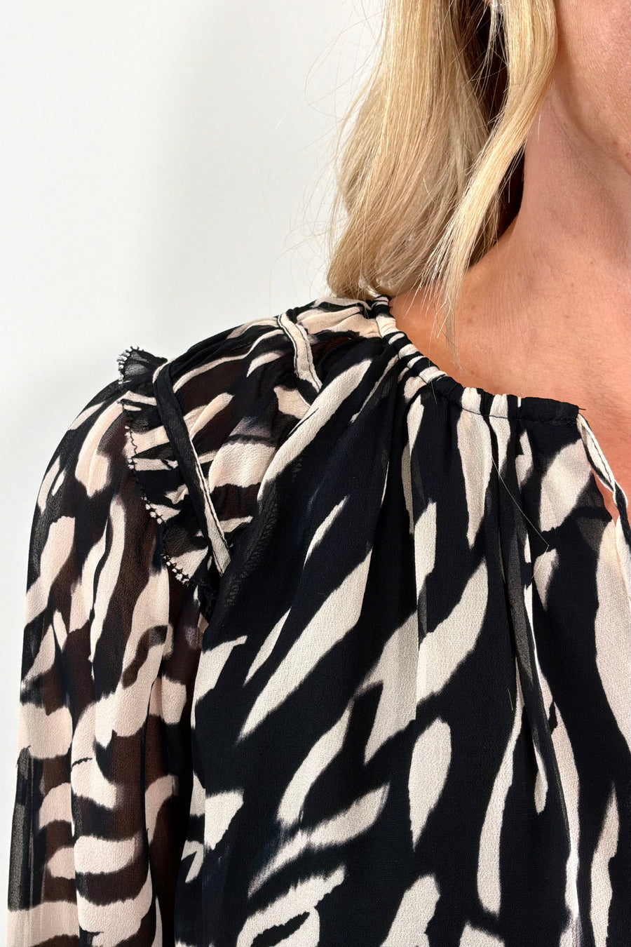 close-up of a lined animal pint chiffon blouse