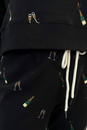close-up of black pants with studded side panels