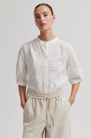 White button up blouse with cut out details