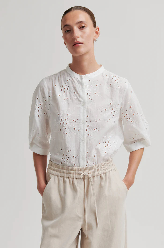 White button up blouse with cut out details