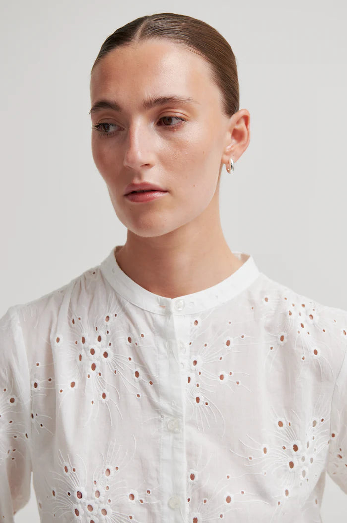 White button up blouse with cut out details