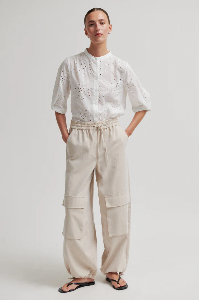 White button up blouse with cut out details