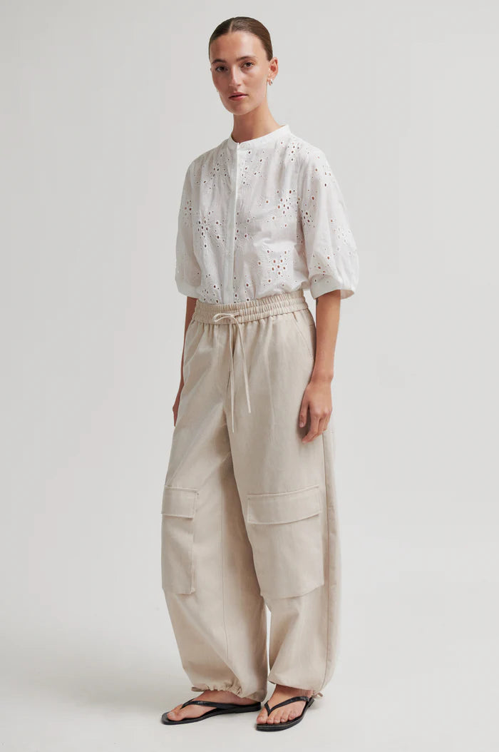 White button up blouse with cut out details