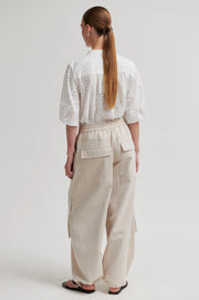 White button up blouse with cut out details