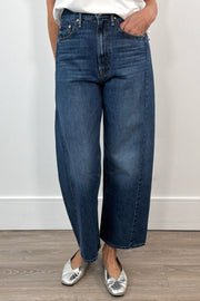 woman wearing an ankle soft barrel blue jean