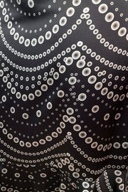Close-up of a black fabric with white circular pattern