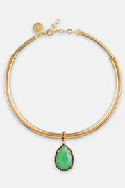 Gold necklace with a green teardrop pendant on a white background