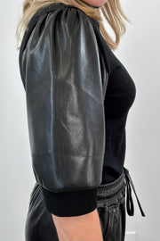 close-up of a black half sleeve mix media top 