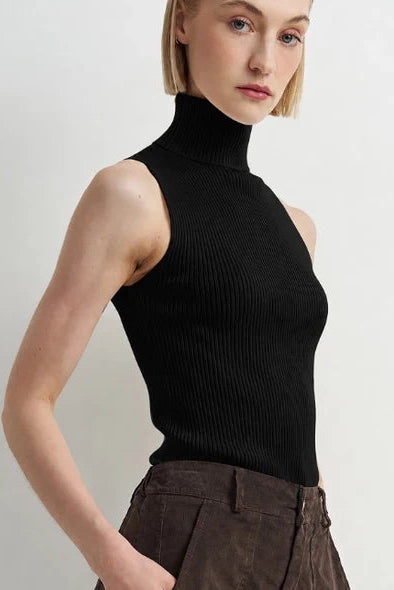 woman wearing black sleeveless turtleneck sweater 