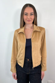 woman wearing a faux suede tan leader jacket with stud details