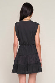 Back view of Woman wearing a black eyelet dress