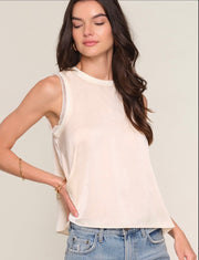 Close up of Woman wearing a cream tank top 