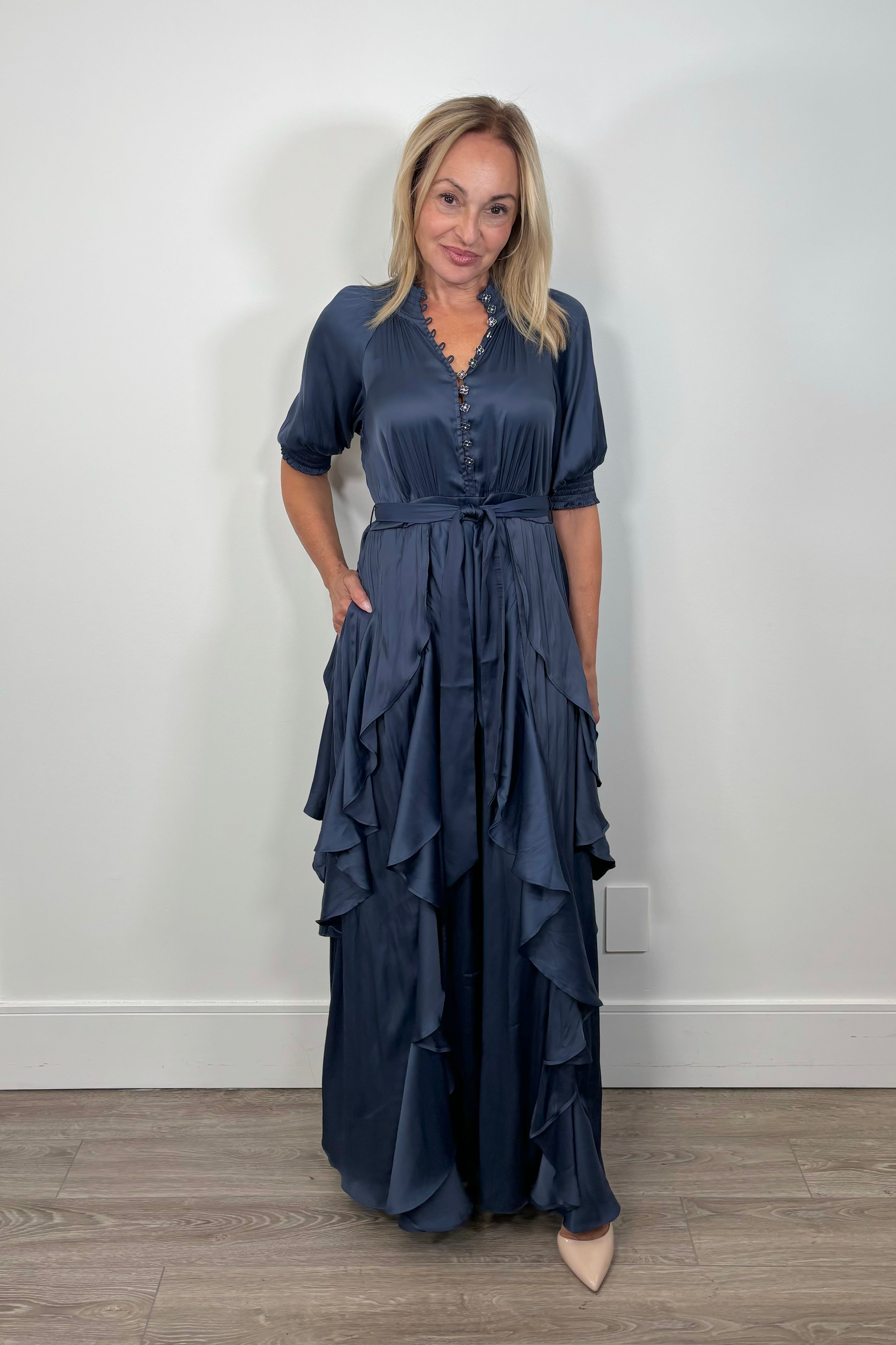 Front view of woman wearing a maxi dress with ruffles