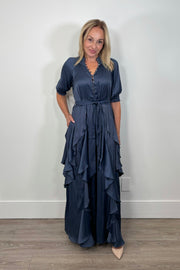 Front view of woman wearing a maxi dress with ruffles
