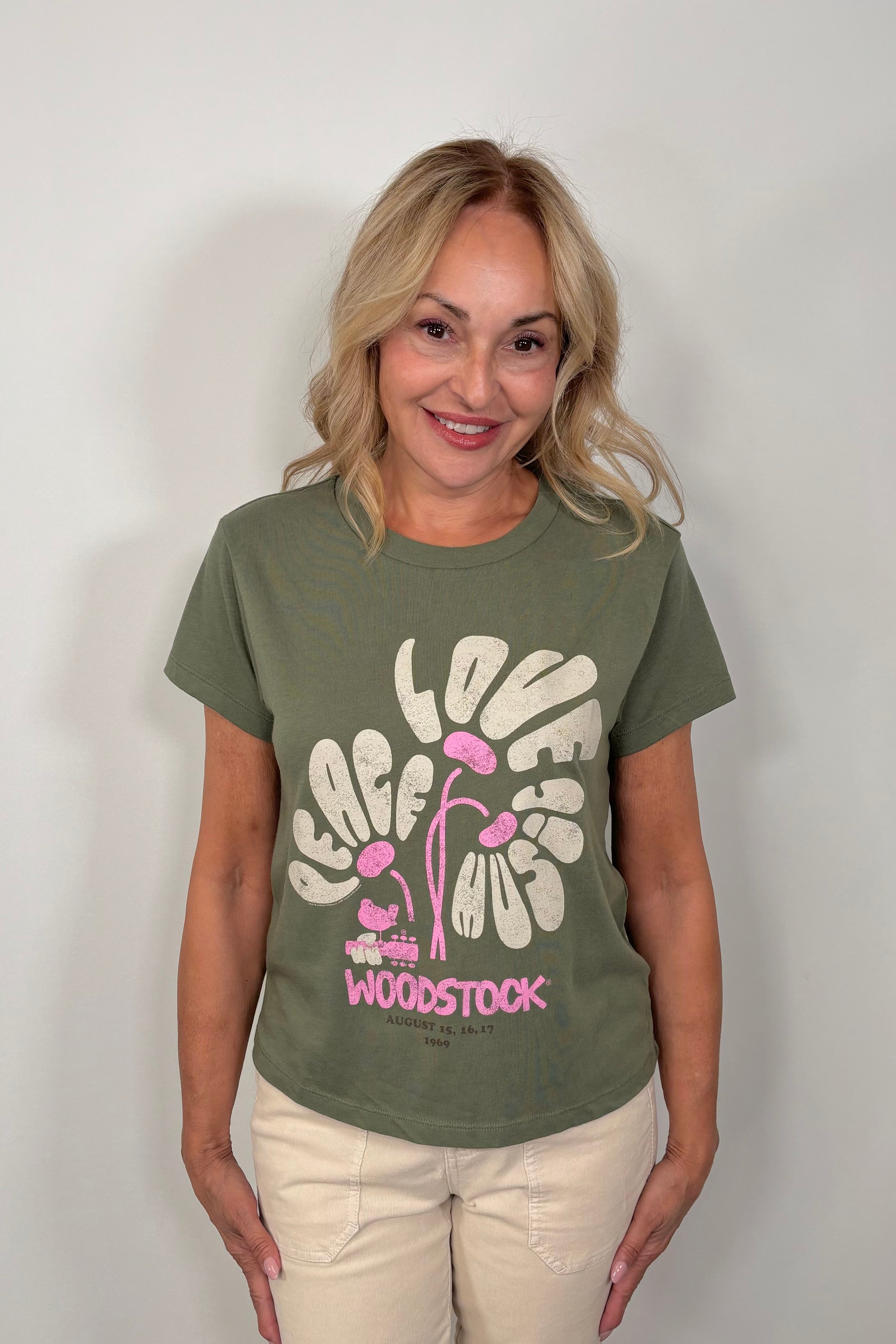 woman wearing a woodstok-festival printed tee