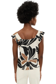 Woman wearing a sleeveless linen top with lotus pattern