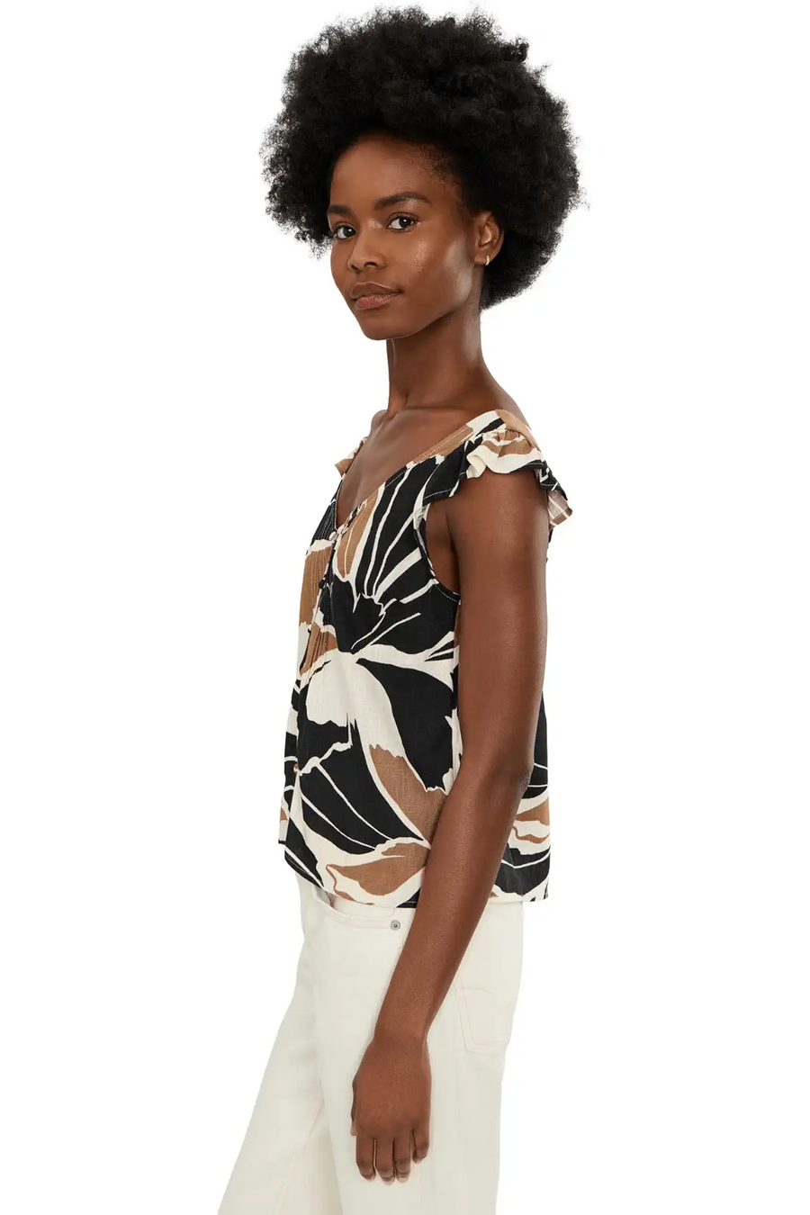 Woman wearing a sleeveless linen top with lotus pattern
