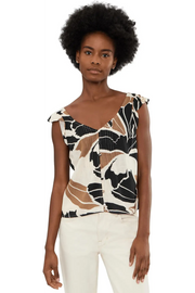 Woman wearing a sleeveless linen top with lotus pattern