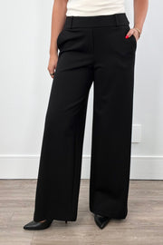 Women wearing black wide-leg pants