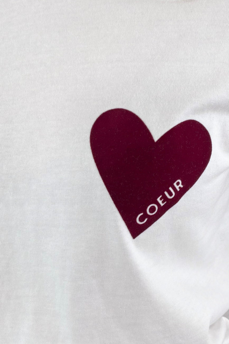White shirt with a maroon heart and 'COEUR' text on a white background