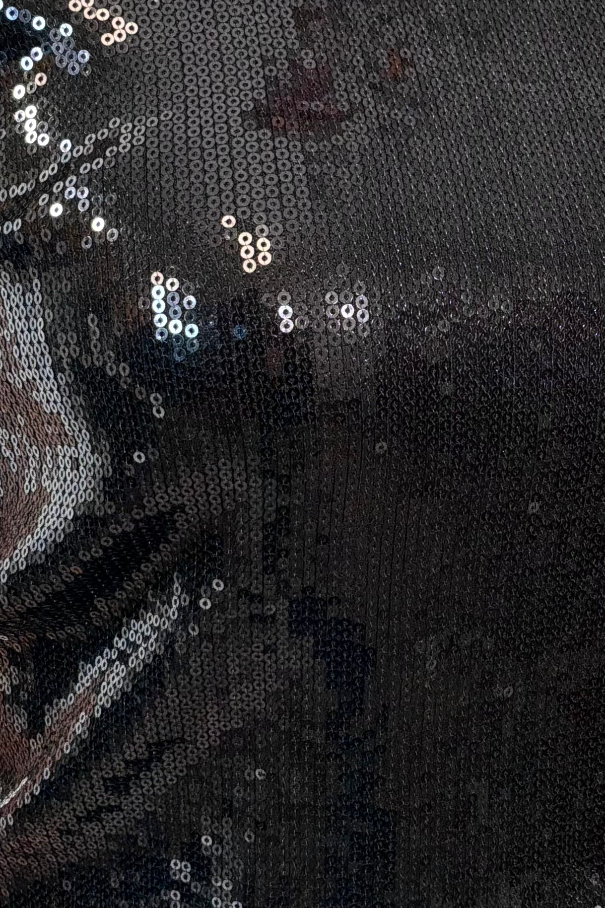 Close-up of a black sequin tank top