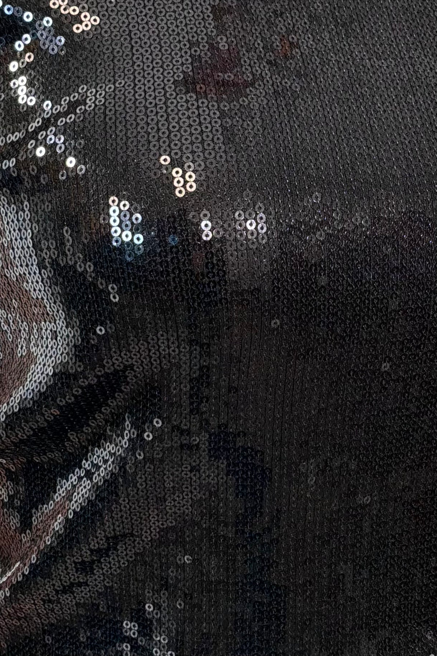 Close-up of a black sequin tank top