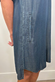 Close-up of the pocket of a blue tencel yoke midi dress