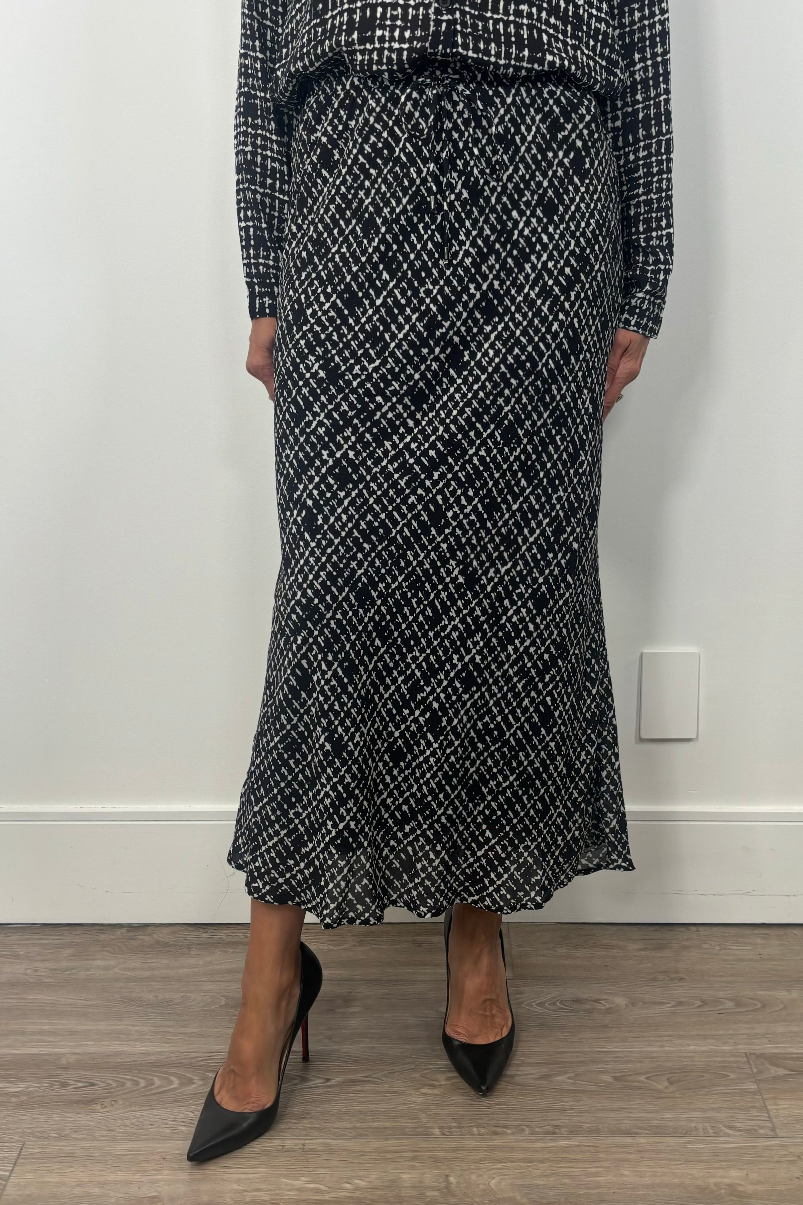 woman wearing a printed maxi skirt