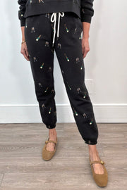woman wearing straight leg, fitted champagne  print sweatpants