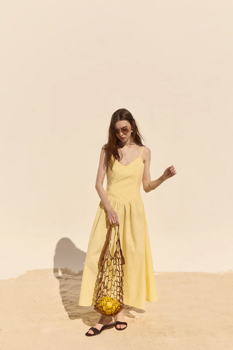 woman wearing a yellow dress