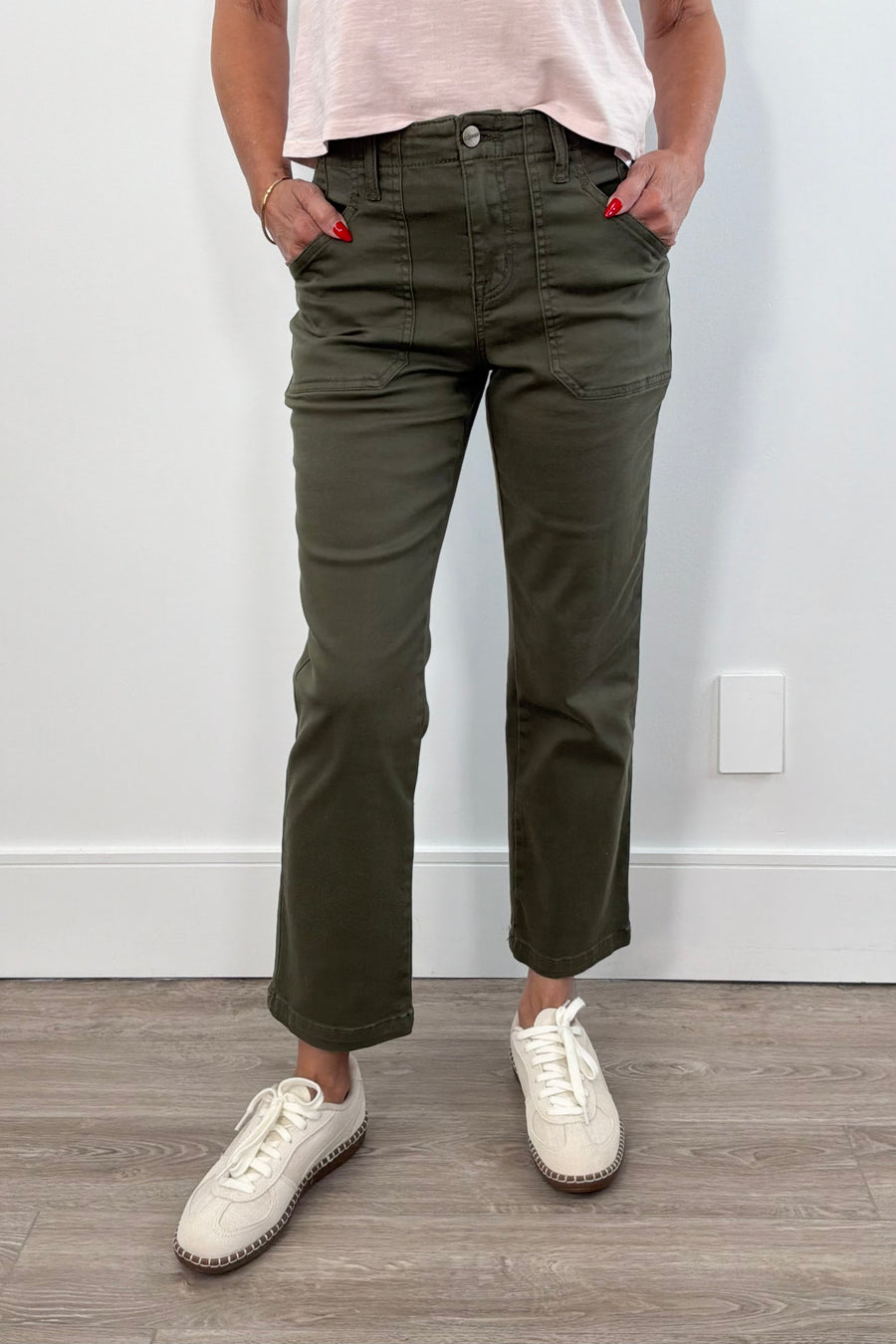 Green pants with large front pockets. 