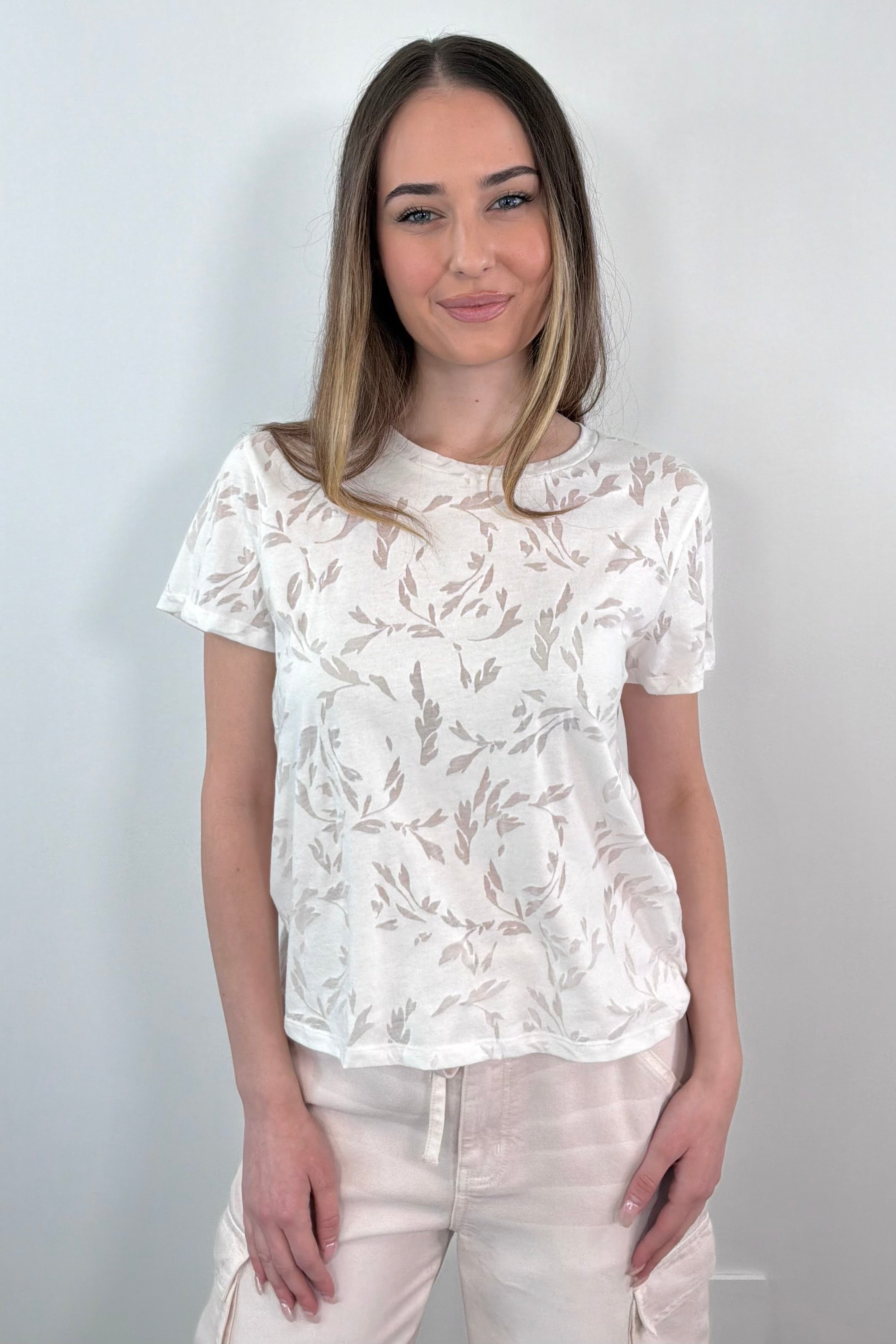 woman wearing a white burn out tee