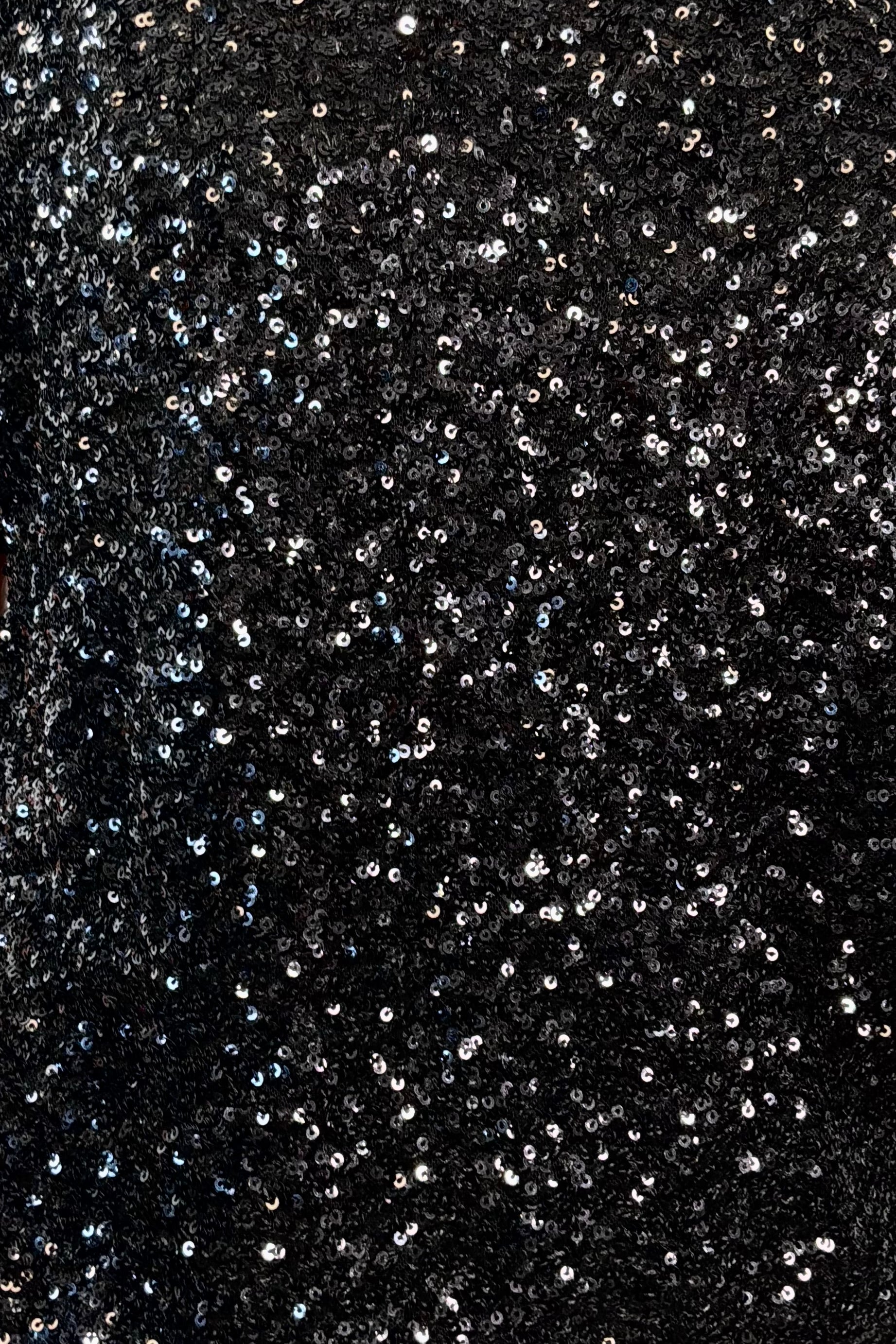close-up of an oversized black sequin top 