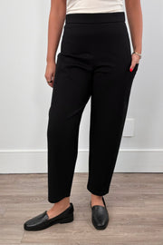 Person wearing black ankle pants