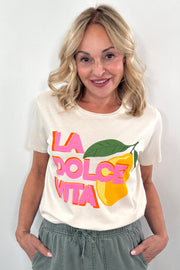Woman wearing while T shirt with ” la dolce vita” details