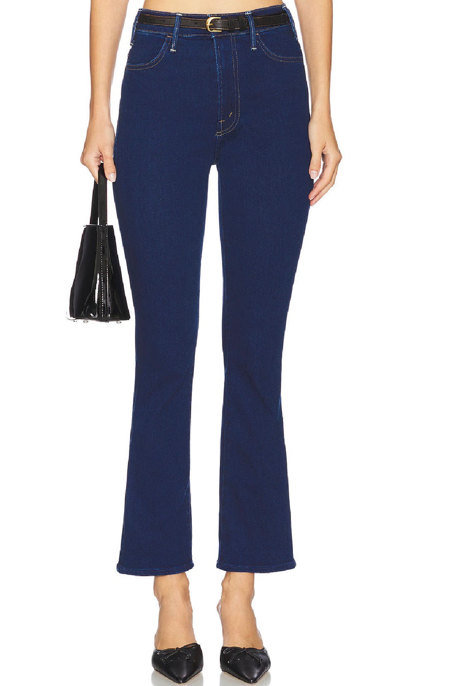 Woman wearing a dark indigo ankle flare jean