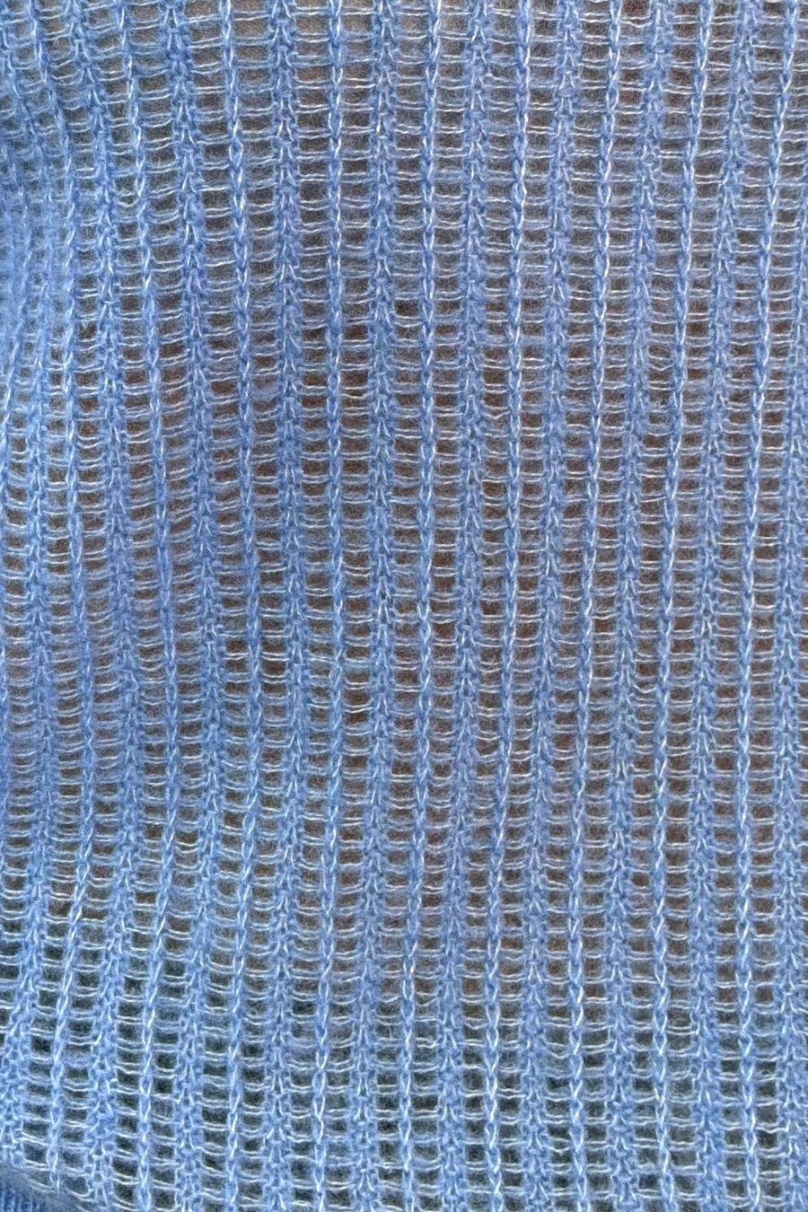 close-up of a blue open knit cashmere sweater 
