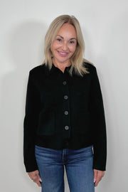 Front view of woman wearing a black cardigan 