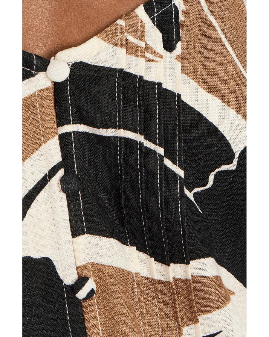 Woman wearing a sleeveless linen top with lotus pattern