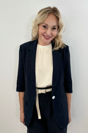 Woman wearing a navy blazer