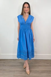 Woman wearing a midi dress in a light blue 