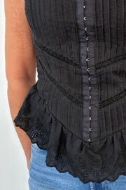 Close up of Woman wearing a corvette top in black