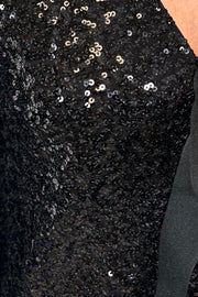 Close-up of a black sequinned tie front cardigan