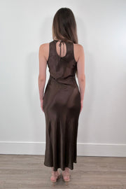 woman wearing a brown satin dress