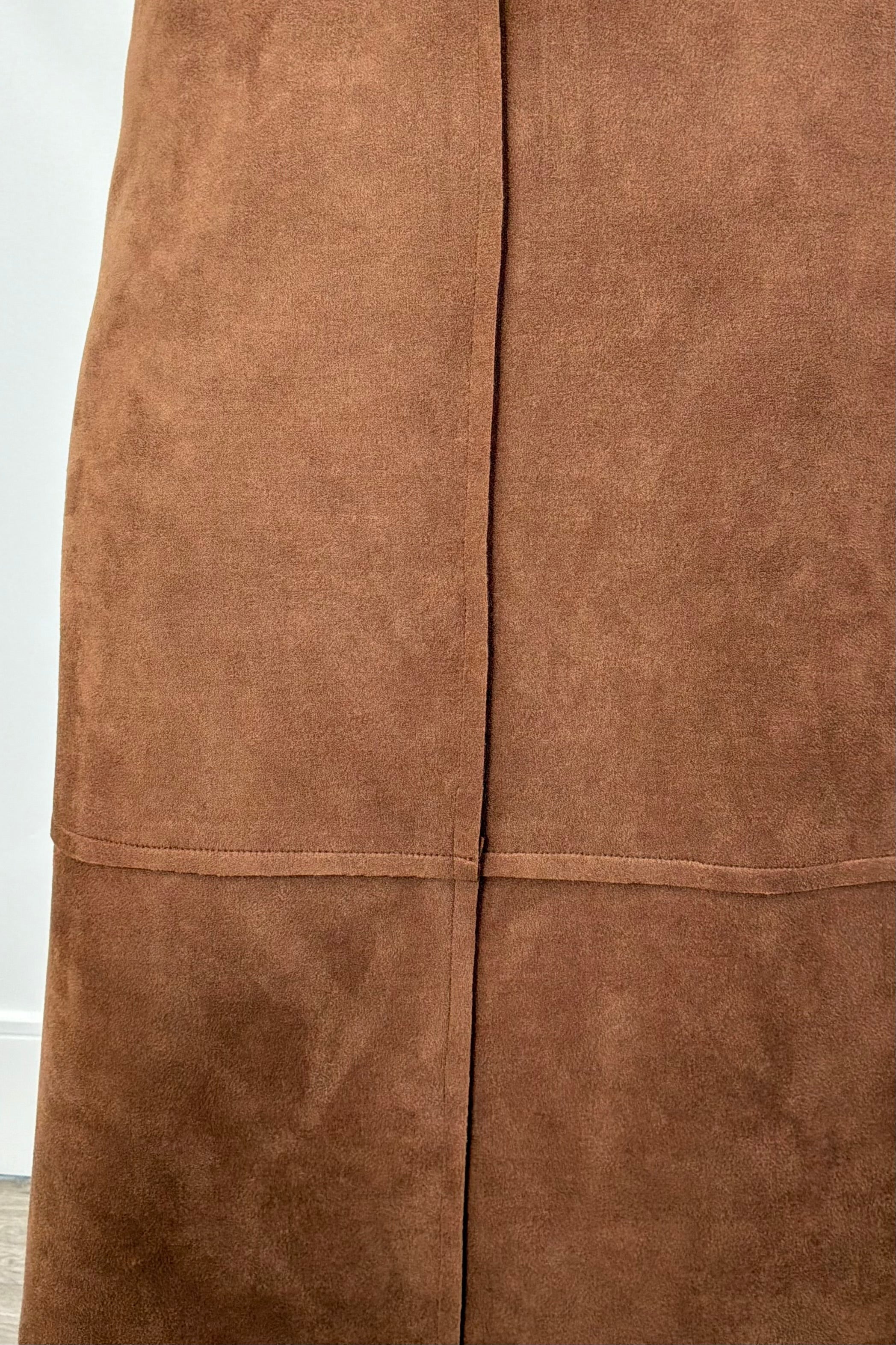 Women wearing a brown suede skirt