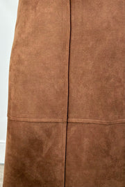 Women wearing a brown suede skirt