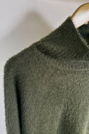 close-up of a green mock neck half sleeve sweater